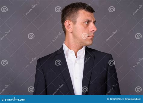 Handsome Businessman With Short Hair Against Gray Background Stock