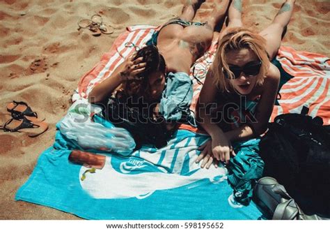 Sexy Bikini Girls Sunbathing Getting Fun Stock Photo