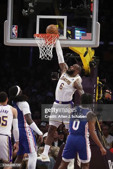 Lakers Forward Lebron James Dunks Over 76ers Center Montrezl Harrell