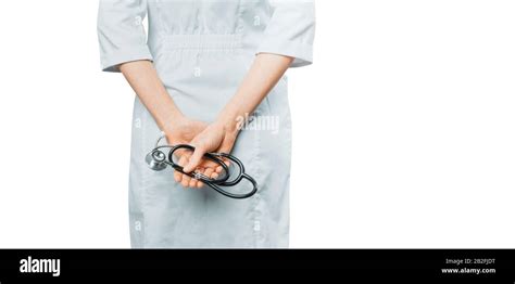 Female Doctor In White Coat Holding Stethoscope In His Hands Rear View