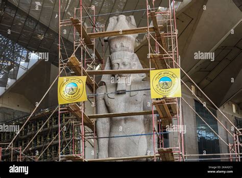 Egyptian Workers Restore A Giant Granite Statue Of The Ancient Egyptian