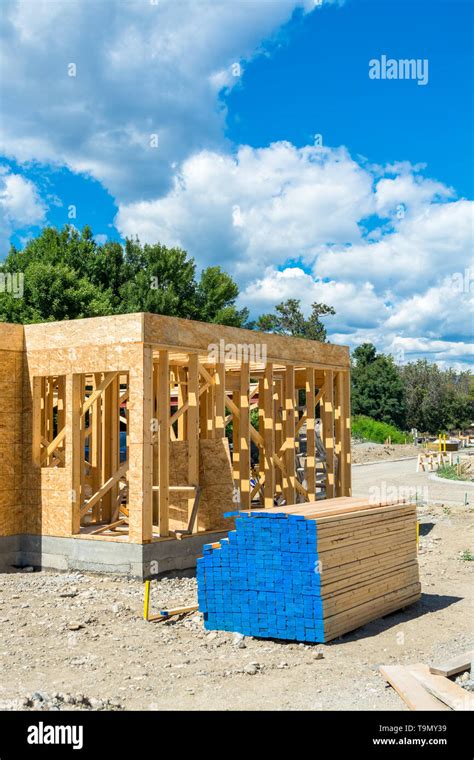 Wooden frame of new building with lumber materials prepared for construction Stock Photo - Alamy