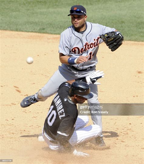 Placido Polanco Of The Detroit Tigers Turns A Game Ending Double Play