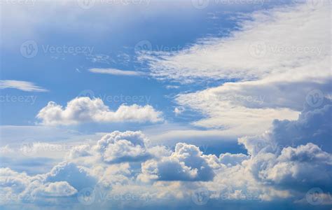 The sky is bright blue with beautiful fluffy clouds. blue sky with ...