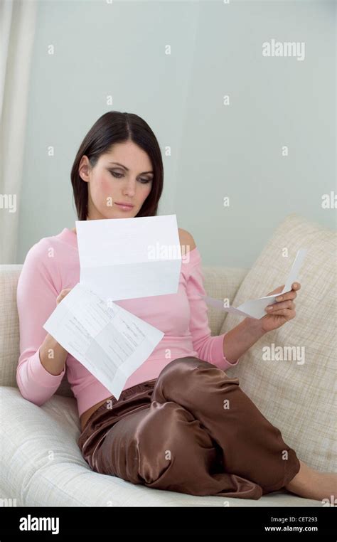 Female Short Brunette Hair Wearing Off The Shoulder Pink Top Length Sleeves And Brown Satin