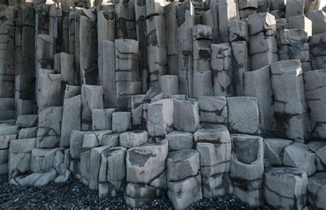 Premium Photo | Basalt rock pillars columns at reynisfjara beach near ...