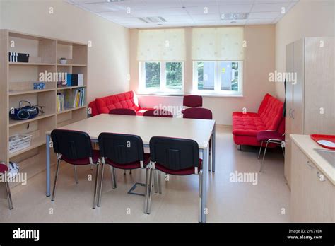 A school staff room or teacher's room, a rest room with sofa and chairs ...