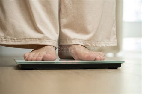 Woman Stepping On Floor Scales Indoors Close Up Weight Control Stock