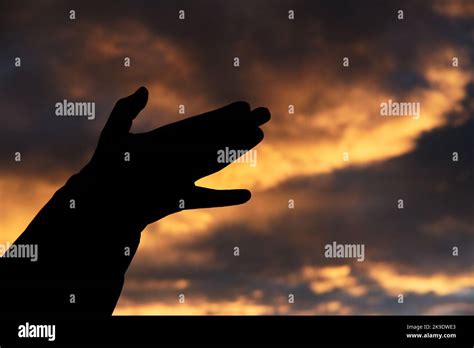 Sunset Hand Silhouette Stock Photo - Alamy