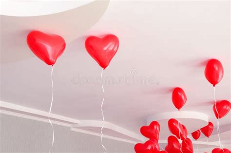 Red Heart Shaped Inflatable Helium Balloons Hang From The Ceiling