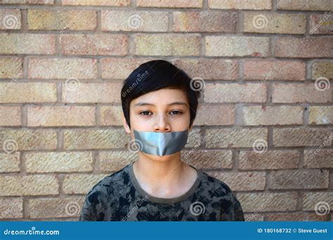 Teenage Boy with Mouth Taped Shut Stock Photo - Image of teenage, teeth ...