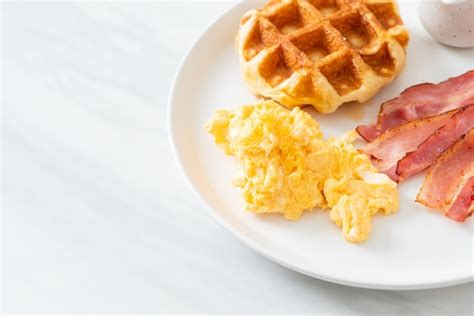 Premium Photo Scrambled Egg With Bacon And Waffle For Breakfast