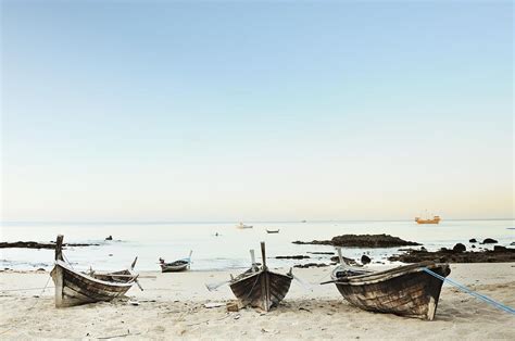 Old Fishing Boats On The Beach By Carlina Teteris