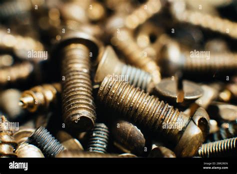 Close Up Macro Old Soviet Brass Pan Head Screw With A Flat Head Screwdriver Texture