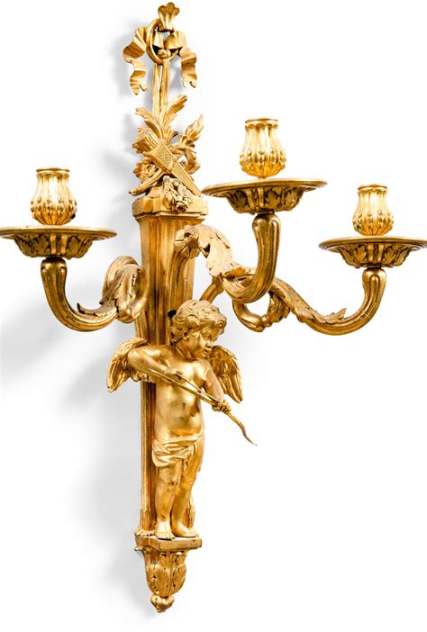 A Pair Of Louis Xvi Gilt Bronze Three Light Cupid Wall Lights Circa