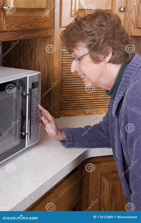 Senior Mature Woman Cooking Microwave Oven Kitchen Stock Image Image