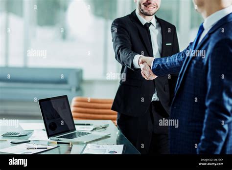 Success Concept In Business Handshake Of Business Partners On The