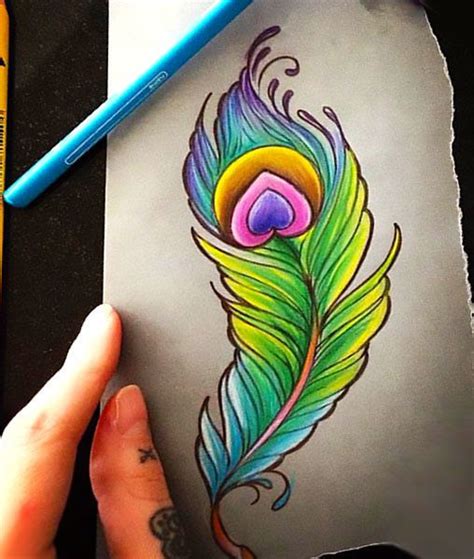 Wonderful colorful peacock feather. Popular girly tattoo. Color ...