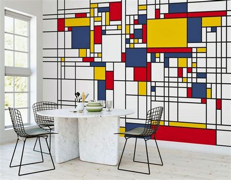 an artistic wall mural in a dining room with chairs and a small table ...