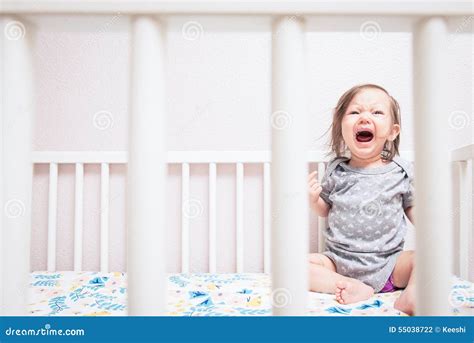 Baby Crying in Crib stock photo. Image of upset, crib - 55038722