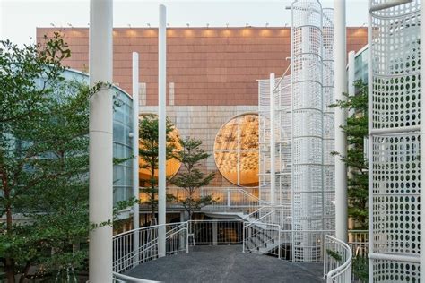 undulating wooden panels form veil-like facade in vietnamese conference ...