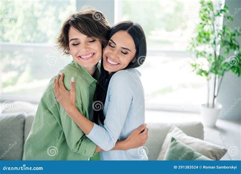 Portrait Of Two Carefree Gorgeous Lady Closed Eyes Toothy Smile Cuddle