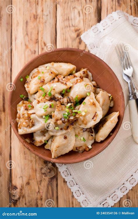 Ukrainian Dumplings With Fried Bacon And Onions Top View Stock Photo