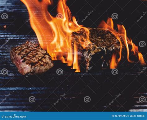 Beef Steak On The Grill Surrounded By Flames Stock Image Image Of