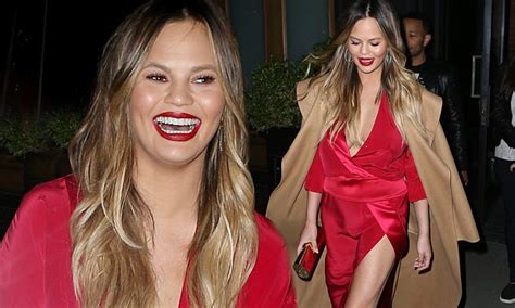 Chrissy Teigen Puts On Another Daring Display In Plunging Scarlet Gown