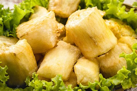 Premium Photo Fried Cassava Snack Made From Cassava Root And Served Fried With Lettuce