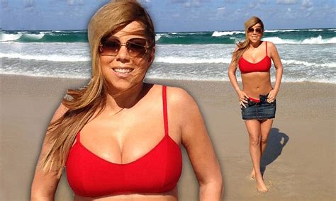 Mariah Carey Flaunts Her Cleavage And Flat Tummy In Red Bikini After