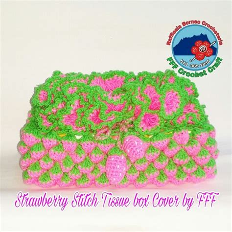 A Pink And Green Crochet Purse With Flowers On It S Side Sitting In