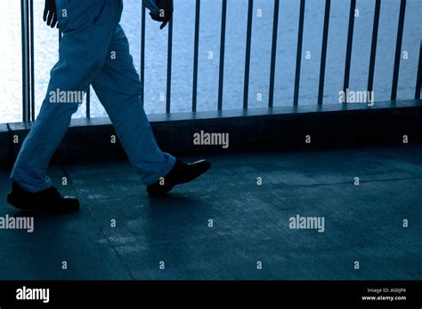 Man Walking Across A Bridge Stock Photo Alamy