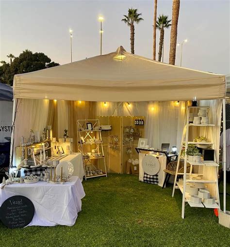 Outdoor Tent with Tables and Chairs Under Palm Trees