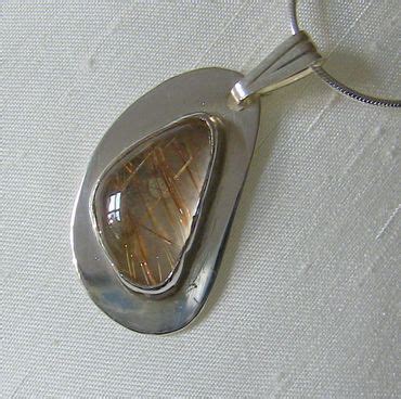 Sterling Silver Freeform Pendant With Rutilated Quartz Gemstone