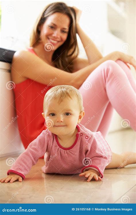 Mother Sitting With Baby Daughter At Home Stock Photo Image Of