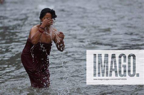 August Kathmandu Nepal A Devotee Takes A Bath On The