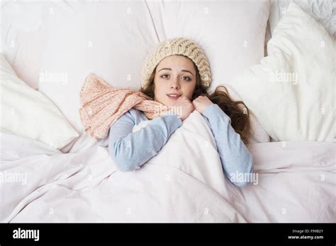 Sick Woman Lying In Bed With High Fever She Has Cold And Flu Stock