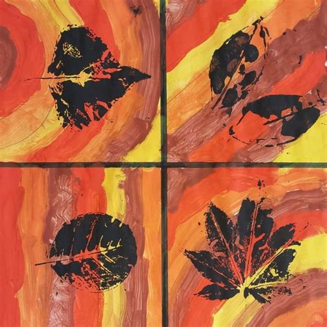 Four Paintings With Leaves Painted On Them In Orange Yellow And Red