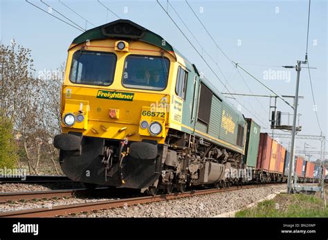 Freightliner class 66 locomotive hauling freight containers on the ...