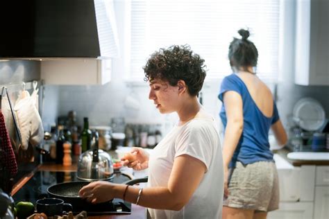 Premium Photo Lesbian Couple Cooking In The Kitchen Together