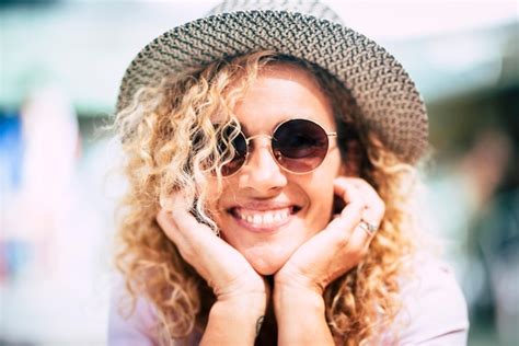 Premium Photo Portrait Of Smiling Woman Wearing Sunglasses