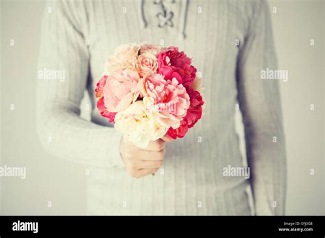 Man Holding Bouquet Of Flowers Stock Photo Alamy