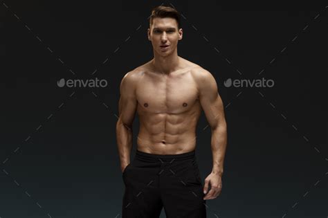 Strong Athletic Man Fitness Model Posing With Naked Torso Showing Six Pack Abs Stock Photo By