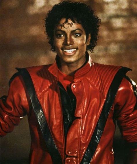 A Man Wearing A Red Leather Jacket And Black Suspenders