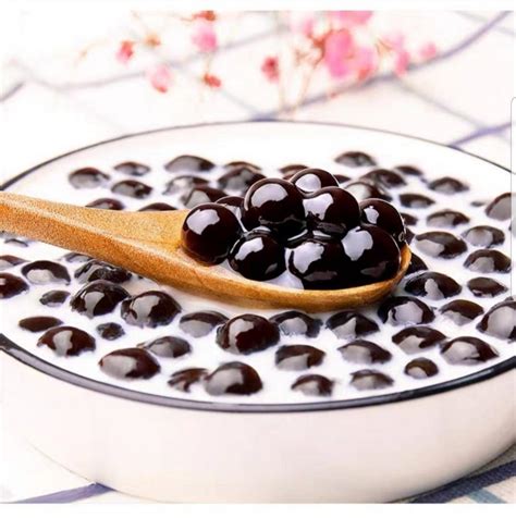 Bubble tea pearls. Black sugar tapioca pearls, raw uncooked, Food ...