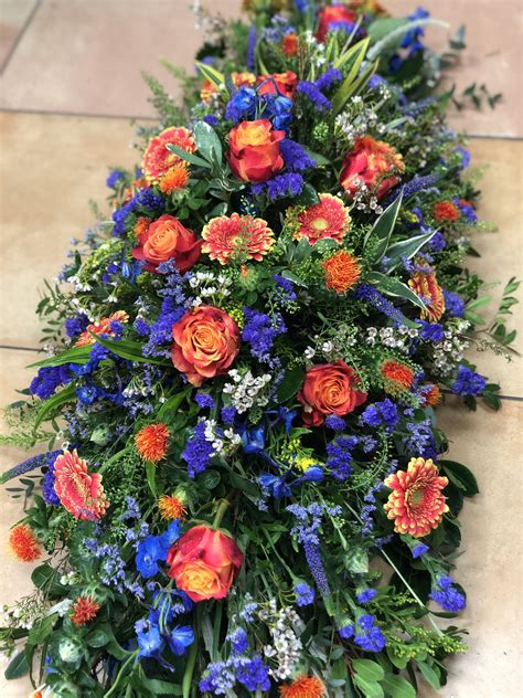 Bright Mixed Flower Coffin Spray Purpleblue And Orange Funeral Flower Arrangements Funeral