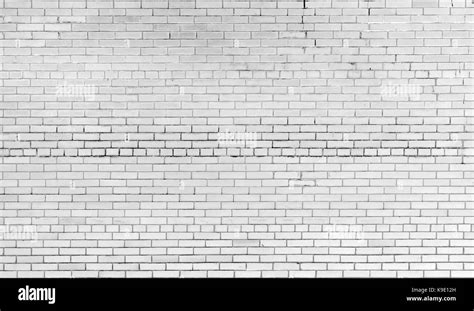 Bricks on cement texture Stock Photo - Alamy