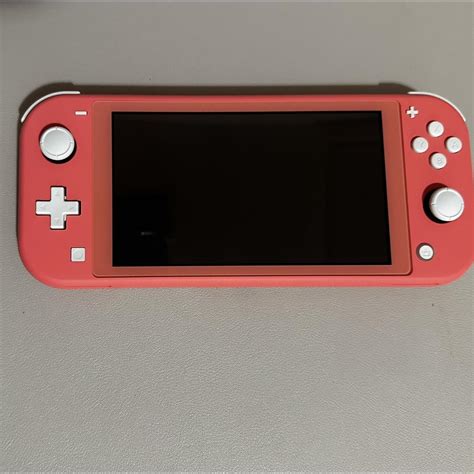 Nintendo Switch Lite Coral. Bought in February of... - Depop