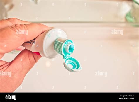 Hand Holding A Messy Toothpaste Tube Stock Photo Alamy